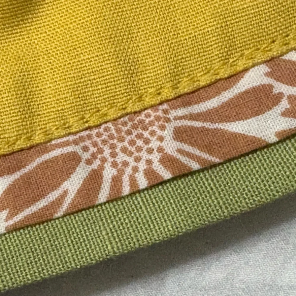 Cute bunny table runner by Pier 1 Imports. Golden yellow with cream bunnies.